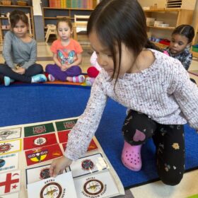 Weetumuw student identifies Tribal Nation flags.